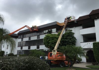 Using two lifts to replace three-story roofs